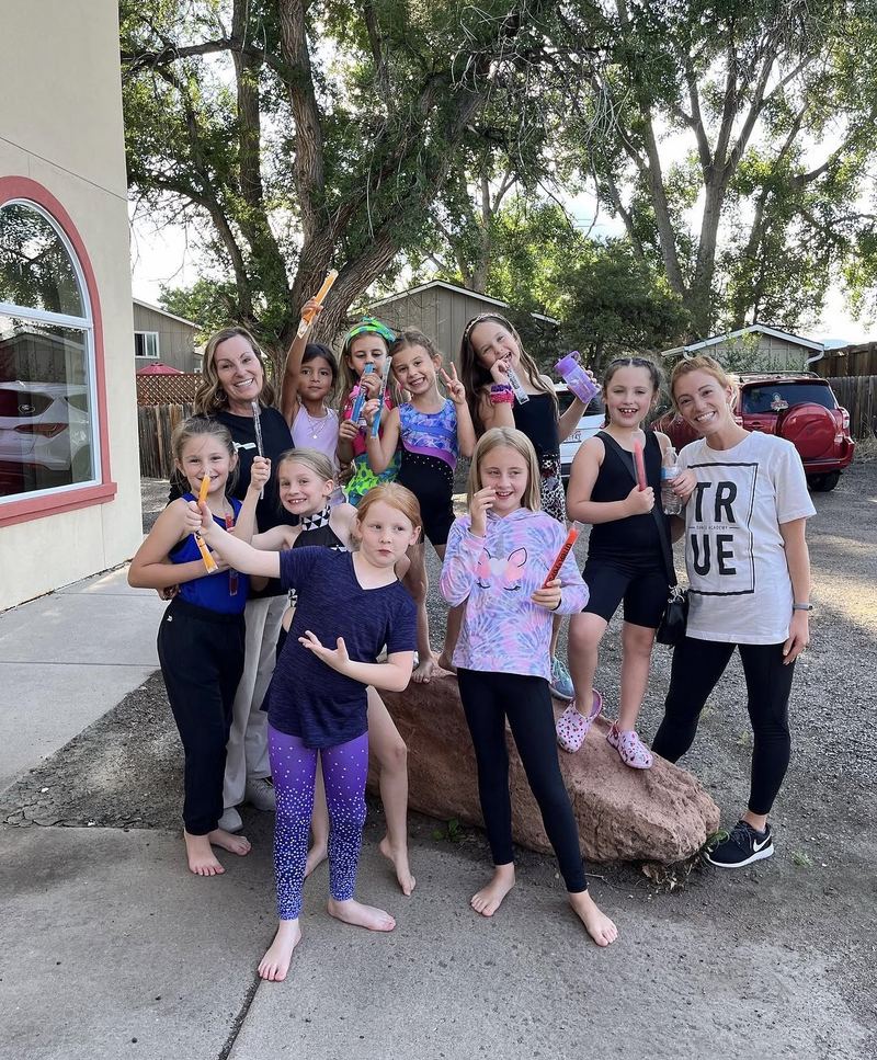 Young dancers and teachers after class