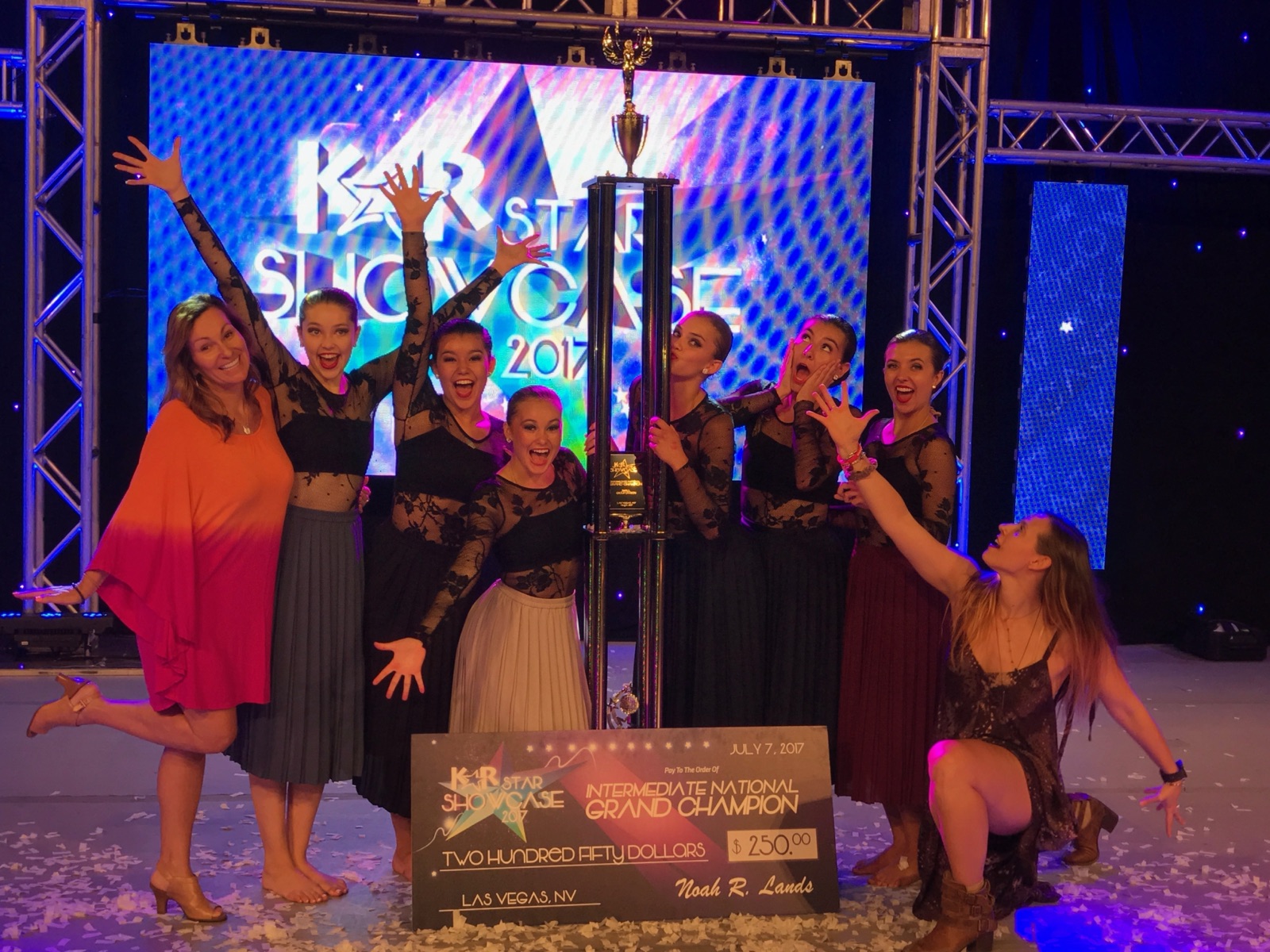 STDA company dancers celebrating an Intermediate National Grand Champion title