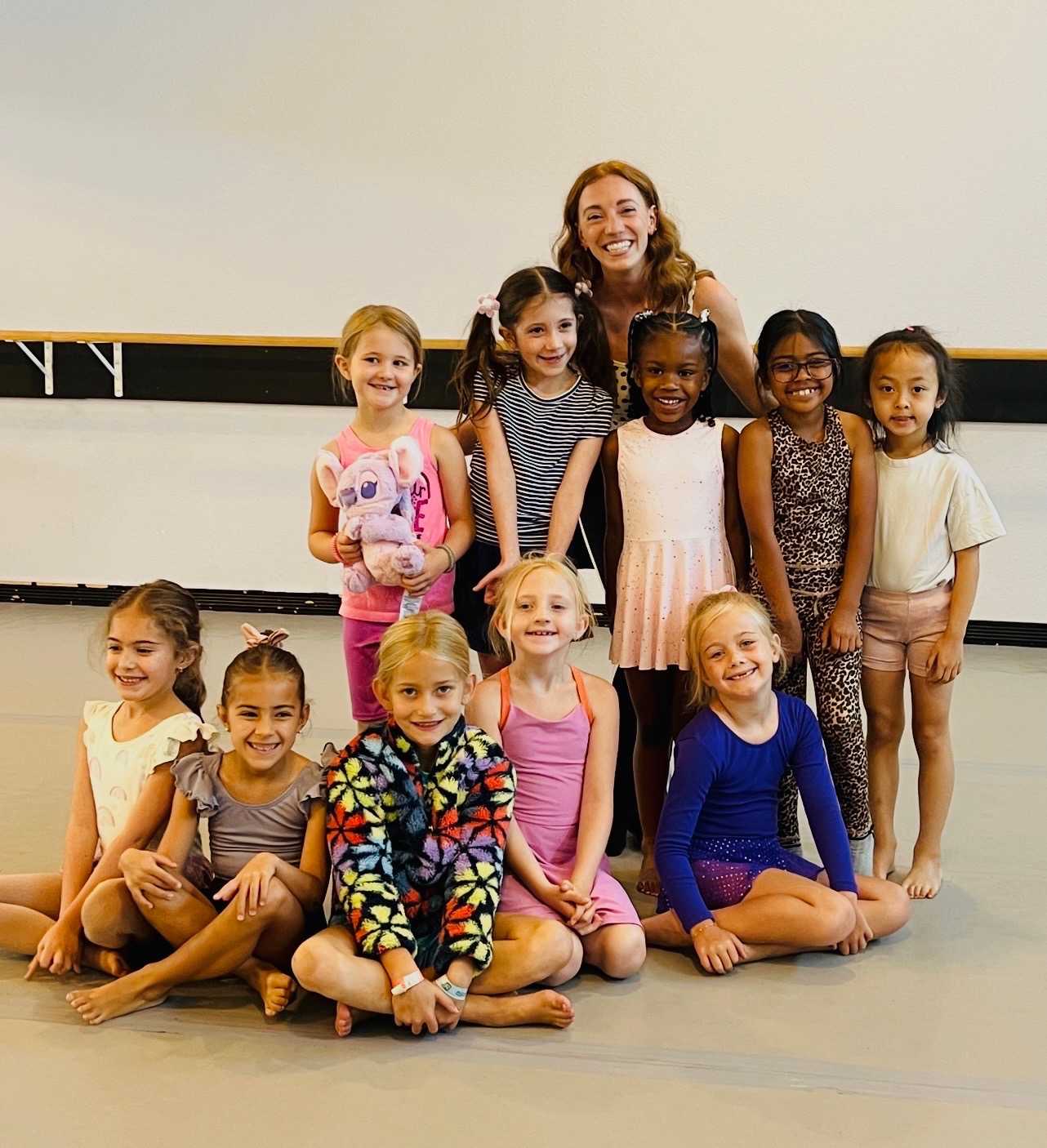 Young recreational dancers with their teacher after class