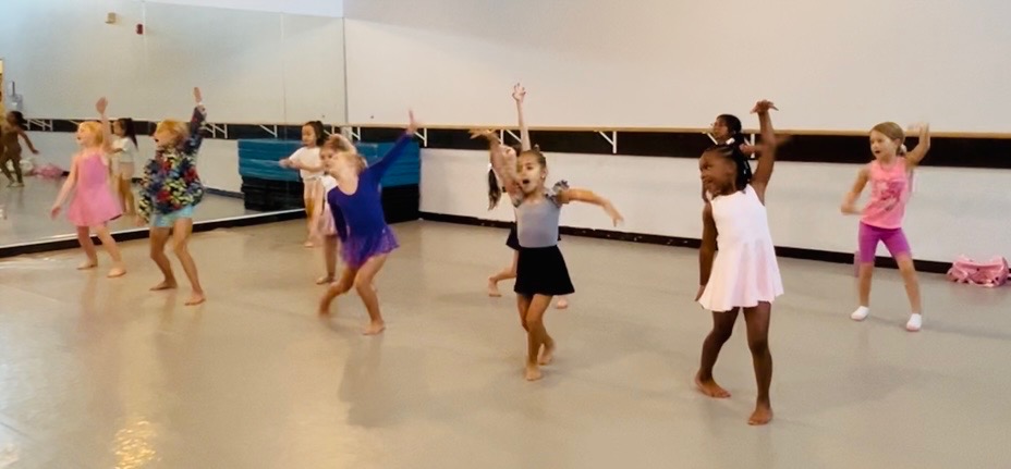 Recreational class dancing across the studio floor