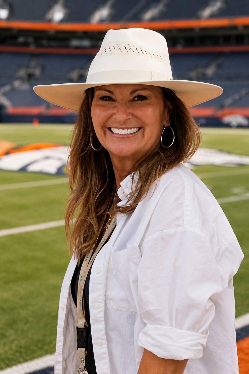 Shelly Trujillo, Owner and Director, on the field at Empower Field